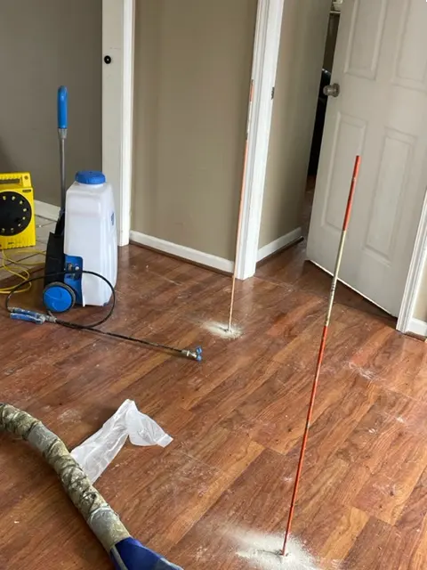 Probing to measure the extent of voids and soil conditions beneath a slab