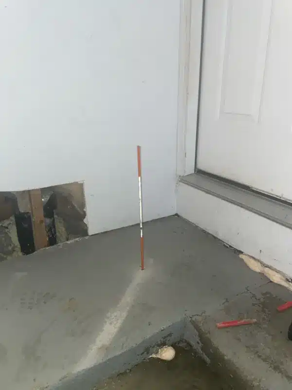 Garage curb during polyurethane leveling and void filling