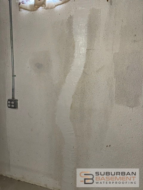 Foundation crack repair finished product - Suburban Basement