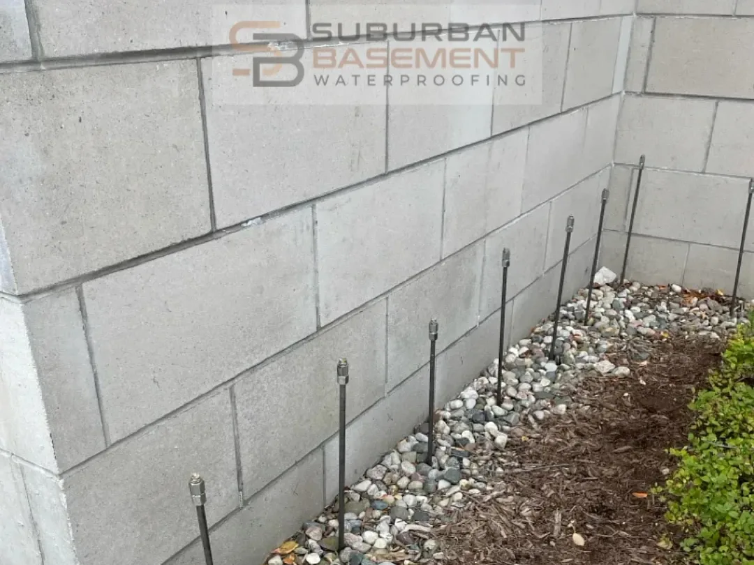 Curtain grouting injection lances sealing a basement wall in Royal Oak