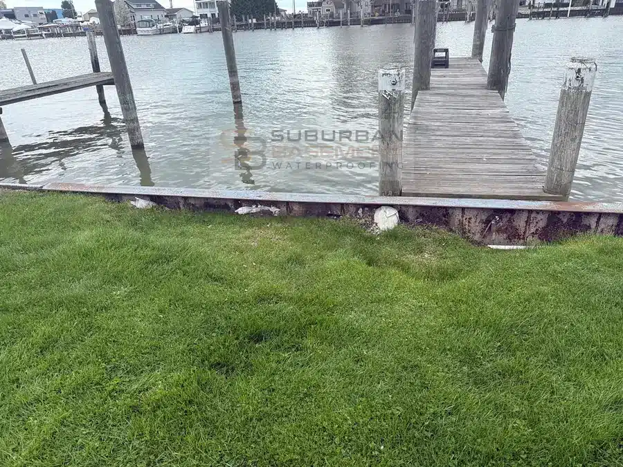Canal seawall and lawn along a Harrison Township MI canal before polyurethane grouting