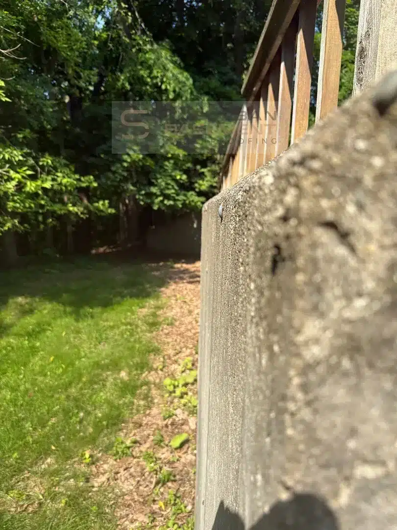 Outward deflection visible along a concrete retaining wall in Farmington Hills MI
